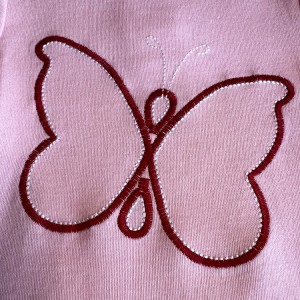 Tiny Tribe pink snapsuit with Red butterfly2
