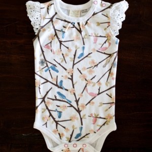 Girl’s body suit in bird pattern